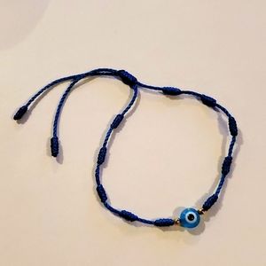 Evil eye bracelet with blue string